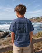 Back view of boy wearing Cooee Coast, coastal flow tee desert sea featuring back print eagle.