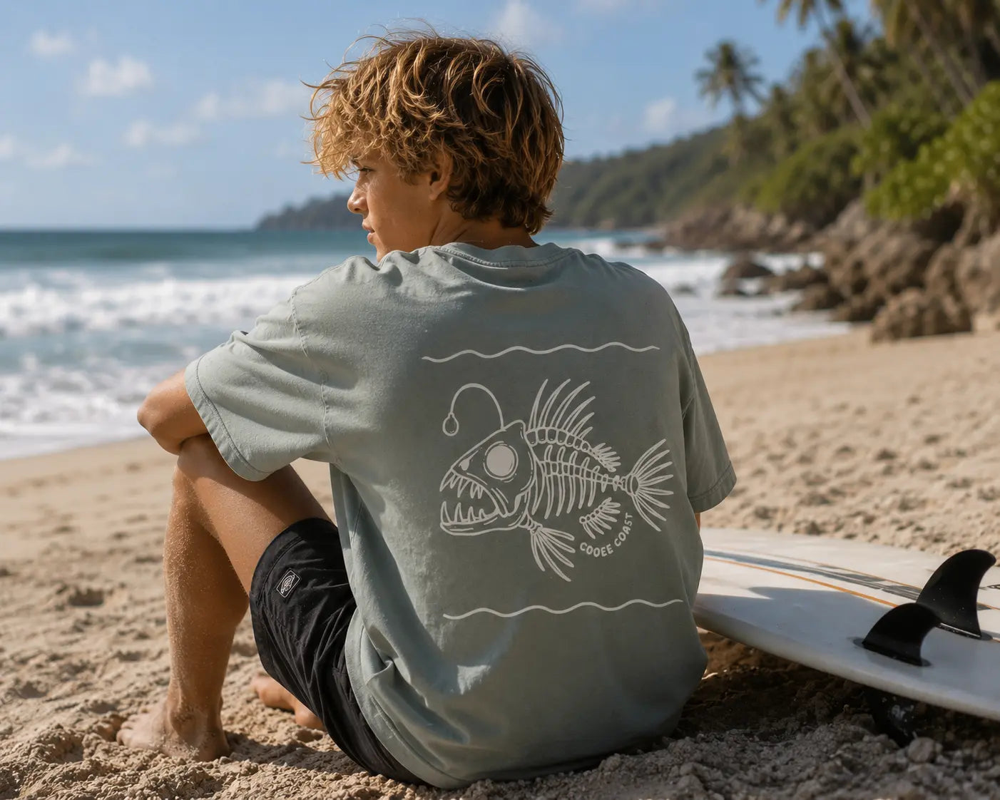 Back view of boy wearing Cooee Coast, coastal flow tee Salty Sage Angler Print