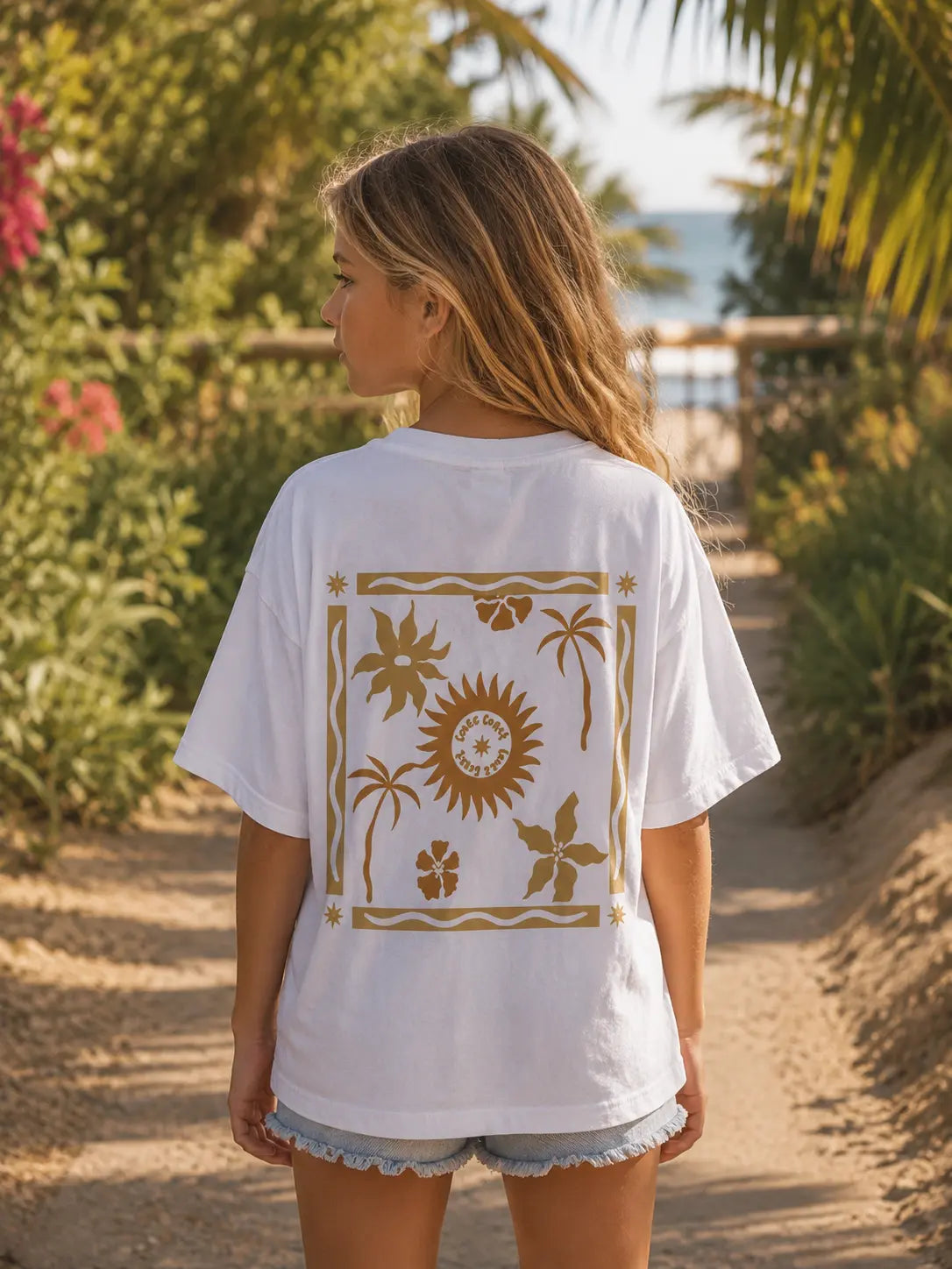 Back view of girls wearing Cooee Coast, coastal flow tee featuring sun back print