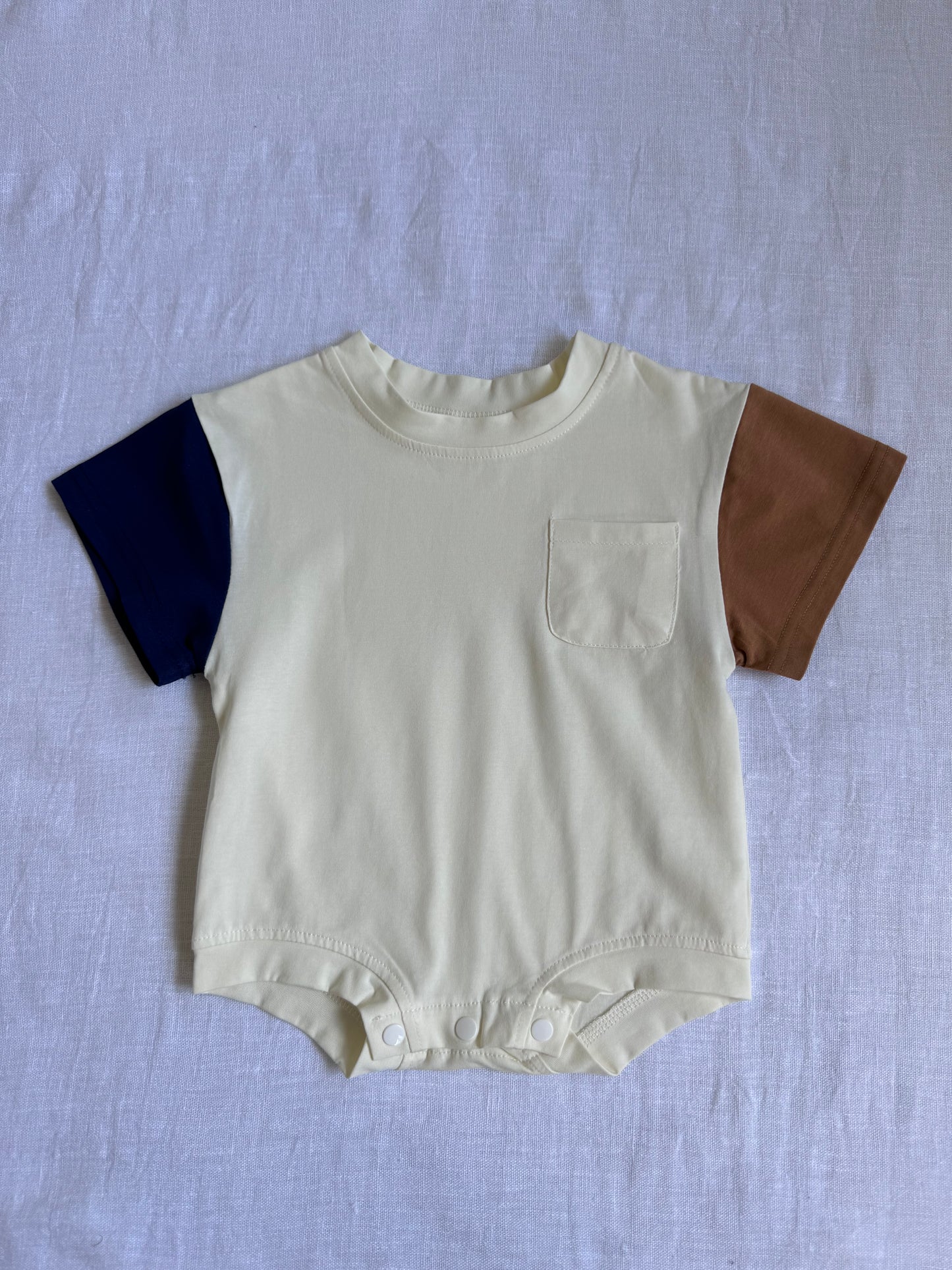 Color-blocked infant romper with pocket