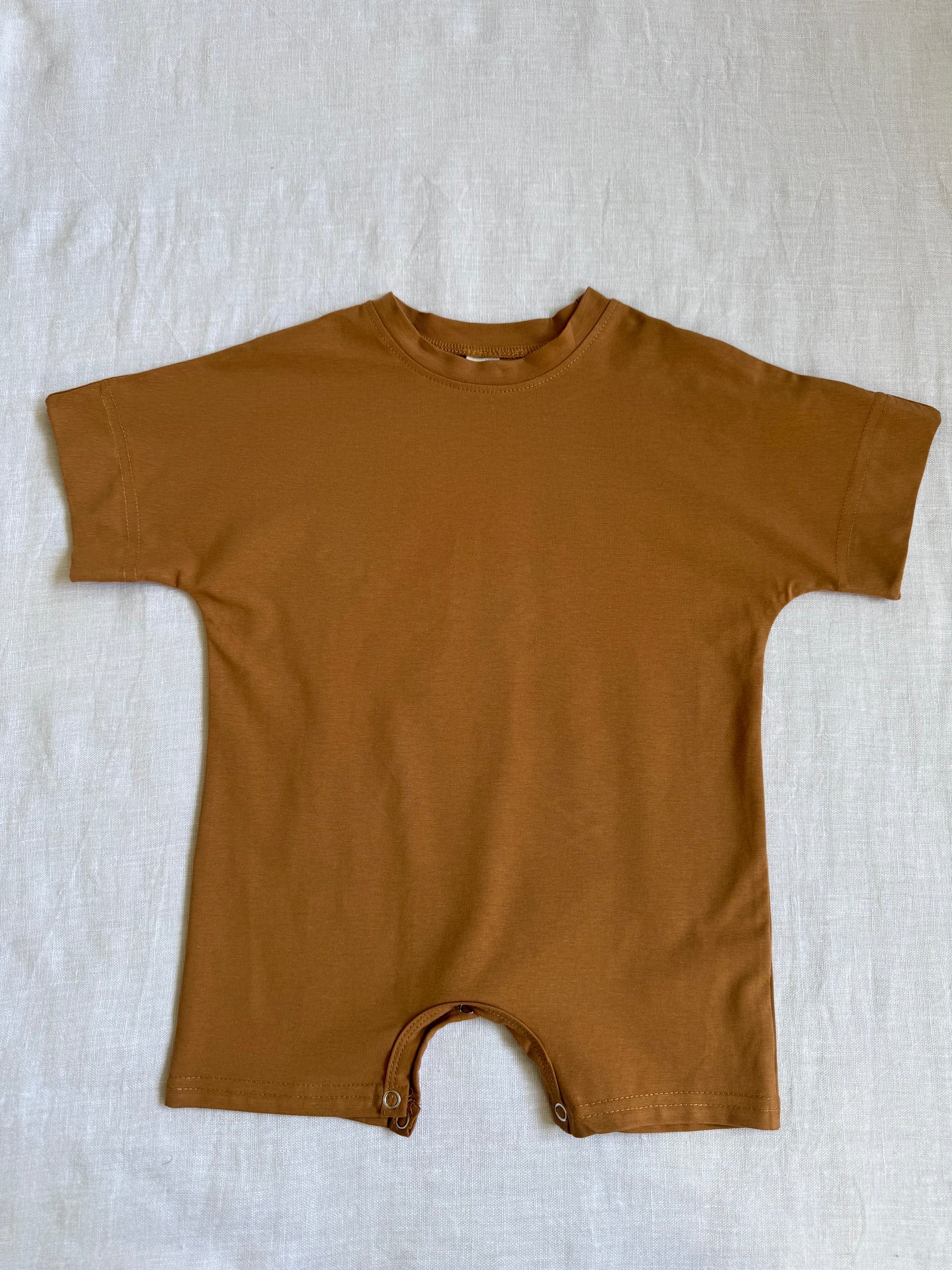 Brown infant romper with short sleeves