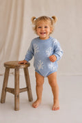 Baby wearing Cooee Coast Reef Romper in ocean blue with reef-inspired knit pattern