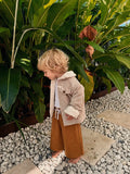 Child wearing Cooee Coast Teddy-Lined Corduroy Jacket featuring soft cord texture and relaxed Fit. 