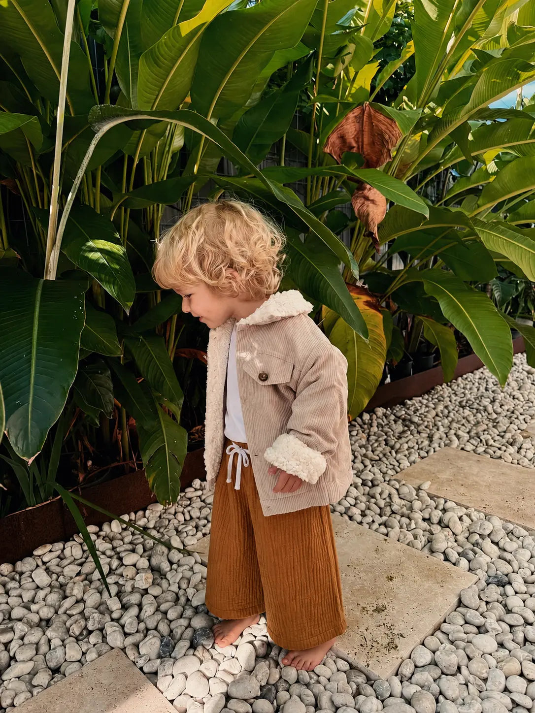 Child wearing Cooee Coast Teddy-Lined Corduroy Jacket featuring soft cord texture and relaxed Fit. 